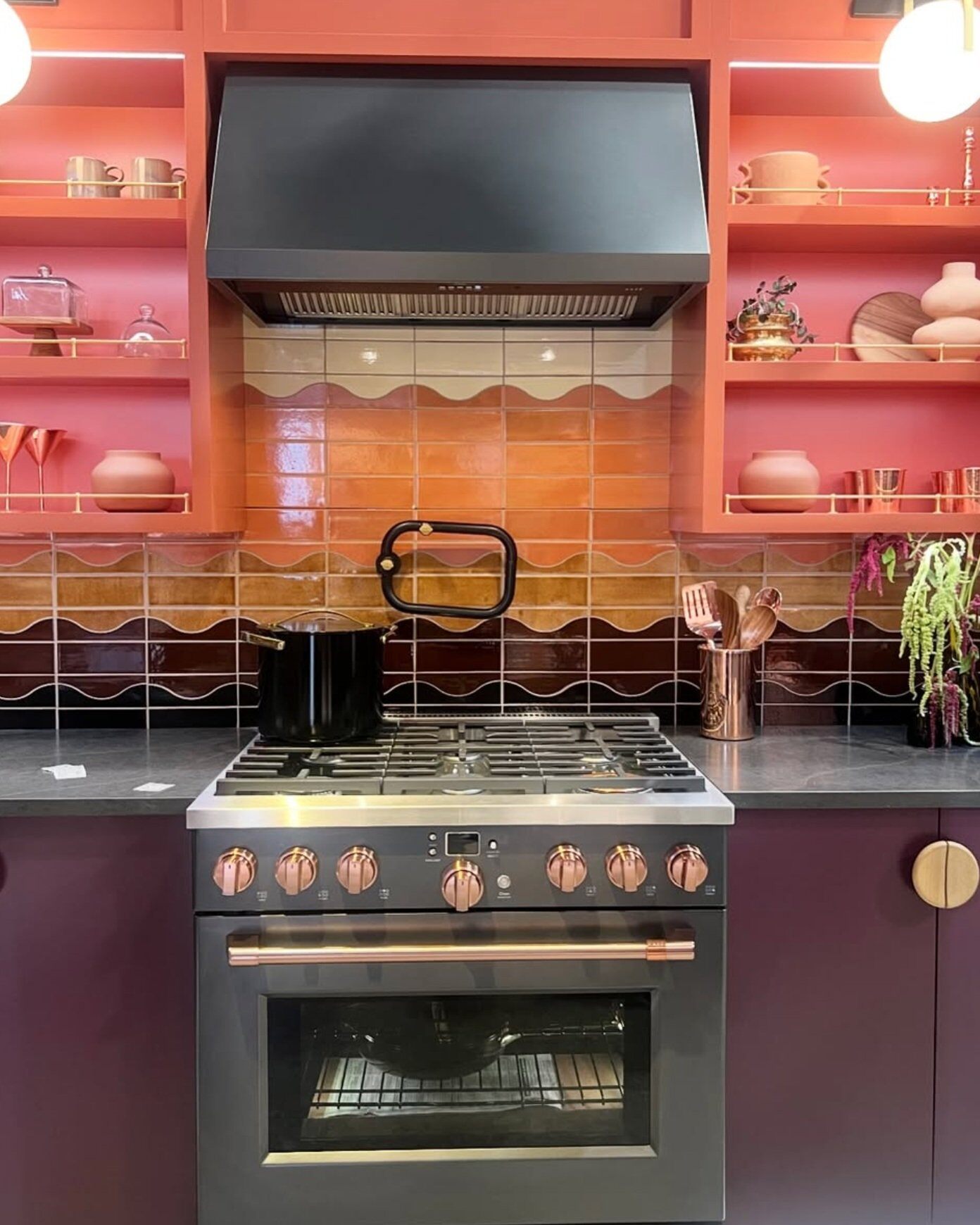 Colorful kitchen remodel by Cafe Appliances featuring Mercury Mosaics tile taken at KBIS by honeycomb Design and Build