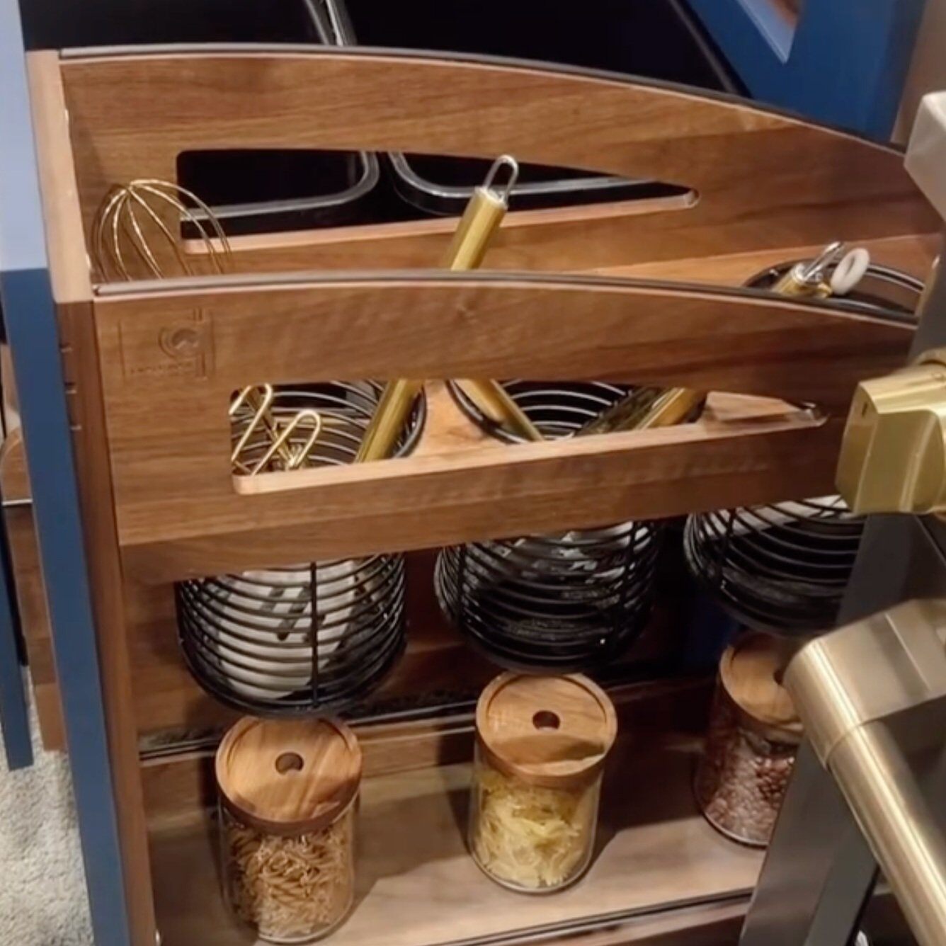Aging in place spice rack storage for kitchen remodel built by Rev a Shelf, photo taken by Honeycomb Design and Build in San Diego